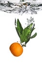 Splash of tangerine to water Royalty Free Stock Photo