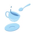 Splash of tea in a mug, saucer and spoon. The concept of teatime