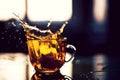 Splash of tea in the sun reflection Royalty Free Stock Photo