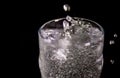 Splash of water on black, Stylish water splash. Isolated on black background, bubbles in the glass Royalty Free Stock Photo