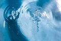 Splash of water close-up. Water drop. A blue drop of water. Falling water. The rain closeup. Blue background