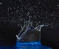 Splash of water crown on blue surface. Royalty Free Stock Photo