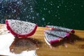 a splash of water drips into the pitaya Royalty Free Stock Photo