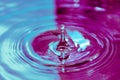 Splash of water with drops as background, closeup, purple and blue Royalty Free Stock Photo