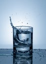 Splash of water in a glass. Splashing water. Ice water. Concept. Royalty Free Stock Photo