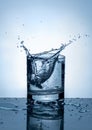 Splash of water in a glass. Splashing water. Ice water. Concept. Royalty Free Stock Photo