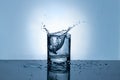 Splash of water in a glass. Splashing water. Ice water. Concept. Royalty Free Stock Photo