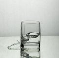 Splash of water in a whisky glass Royalty Free Stock Photo