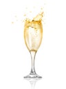 Splashes of champagne splash out of the glass.