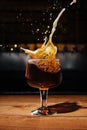 splashes glass of dark Belgian beer Royalty Free Stock Photo
