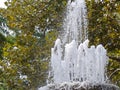 Splashes and jets of the fountain in the city park. A fountain with splashes and drops of water works. Royalty Free Stock Photo