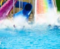 Splashes from people sliding down in pool Royalty Free Stock Photo