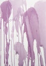 Splashes and runs of muted purple watercolor paint