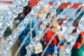 Fountain streams with frozen water drops on a blurry background of walking people Royalty Free Stock Photo
