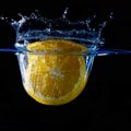 Splashing fruit on water. Royalty Free Stock Photo