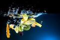 Splashing fruit on water. Royalty Free Stock Photo