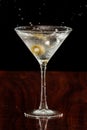 Splashing martini olives