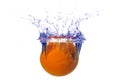 Splashing orange into a water Royalty Free Stock Photo