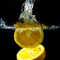 Splashing orange on water Royalty Free Stock Photo