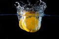 Splashing orange on water Royalty Free Stock Photo