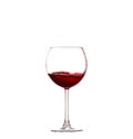 Splashing red wine in a glass. Isolated on white background Royalty Free Stock Photo