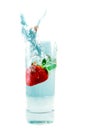 Splashing strawberry Royalty Free Stock Photo