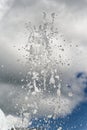 Splashing water and drops from spring fontain Royalty Free Stock Photo
