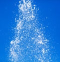 Splashing water from a fountain against the blue sky Royalty Free Stock Photo