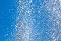 Splashing water from a fountain against the blue sky Royalty Free Stock Photo