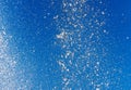 Splashing water from a fountain against the blue sky Royalty Free Stock Photo