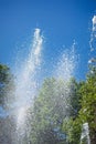 Splashing water fountain against the blue sky Royalty Free Stock Photo