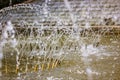 Splashing water in fountain. Water jets of pure clear aqua splashes, pressure Royalty Free Stock Photo