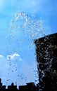 Splashing water isolated on blue background.