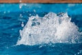 Splashing water in the pool as a background Royalty Free Stock Photo