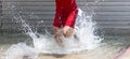 Splashing of water in the steeplechase as a runner is trying to run out Royalty Free Stock Photo