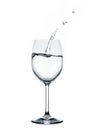 Splashing water wave in the wine glass Royalty Free Stock Photo