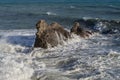 Splashing waves against rocks. Ligurian sea. Italy