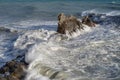 Splashing waves against rocks. Ligurian sea. Italy