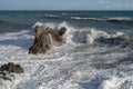 Splashing waves against rocks. Ligurian sea. Italy