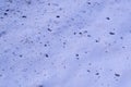 splats of dirt on the snow near the road texture. background, seasonal