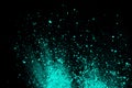 A splatter of green blue colored pigment powder on black background Royalty Free Stock Photo