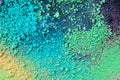 A splatter of green blue natural colored pigment powder on black background Royalty Free Stock Photo