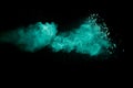 A splatter of green colored powder on black background Royalty Free Stock Photo