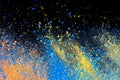 A splatter of pastel natural colored pigment powder on black background Royalty Free Stock Photo