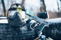 Splattered paintball mask and marker gun Royalty Free Stock Photo