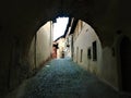 Splendid ancient street and arch in Saluzzo town, Piedmont region, Italy. History, enchanting architecture and art
