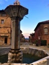 Splendid ancient street and fountain in Saluzzo town, Piedmont region, Italy. History, enchanting architecture and art