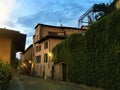 Splendid ancient street and ivy in Saluzzo town, Piedmont region, Italy. History, enchanting architecture and art