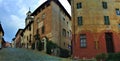Splendid ancient street in Saluzzo town, Piedmont region, Italy. Colours, history, enchanting architecture and art