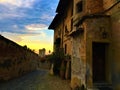 Splendid ancient street in Saluzzo town, Piedmont region, Italy. History, sunset, enchanting architecture and art